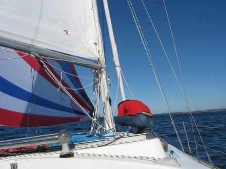 Skipper adjusting the tack of the kite.jpg