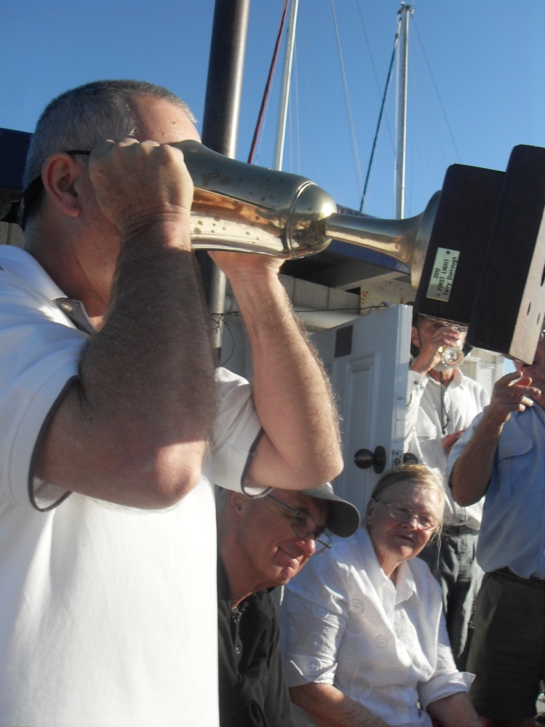 Denis finishing off the rum - after the race.jpg